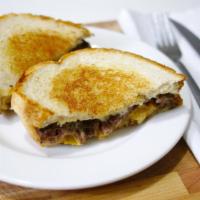Patty Melt · A 1/2 pound. Burger patty topped with melted swiss and American cheese and sautéed onions on...