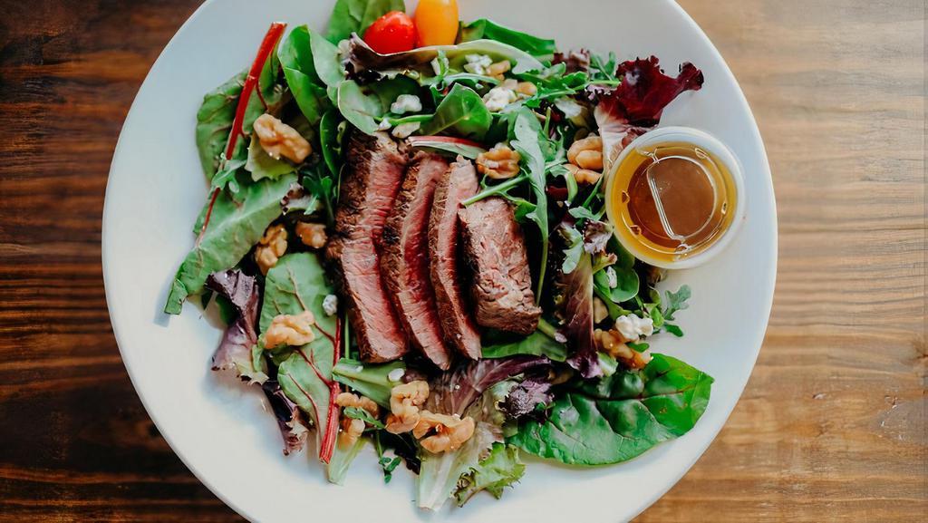 Steak Gorgonzola Salad · Sirloin steak, mixed greens, walnuts, Gorgonzola cheese, balsamic and olive oil vinaigrette dressing. Calories: 410, carbohydrates: 3 g, fiber: 2 g, protein: 37 g, and fats: 29 g.