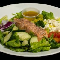 Salmon Greek Salad · Crunchy, organic romaine lettuce, all the classic Greek salad ingredients with a yummy house...