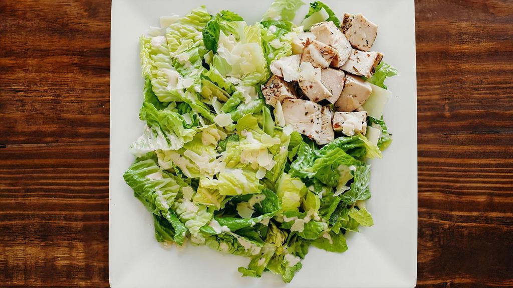 Chicken Caesar Salad · Romaine lettuce, parmesan, herb-sprinkled chicken, Caesar dressing.