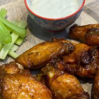Chicken Wings · Delicious chicken wings served with sticks of celery and Blue Cheese