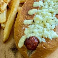 Junior Hot Dog · Colossal quarter pound beef frank, our signature homemade sauce and smoked cheddar cheese on...