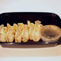 Shrimp Potstickers · Soy-garlic dipping sauce