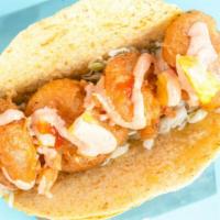 Cancun Shrimp Taco · Large shrimp battered and fried to perfection on a bed of our homemade coleslaw. Topped with...