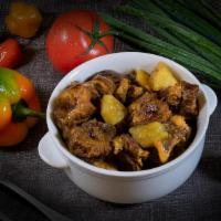 Side Curry Goat · Goat morsels stewed in our savory curry sauce