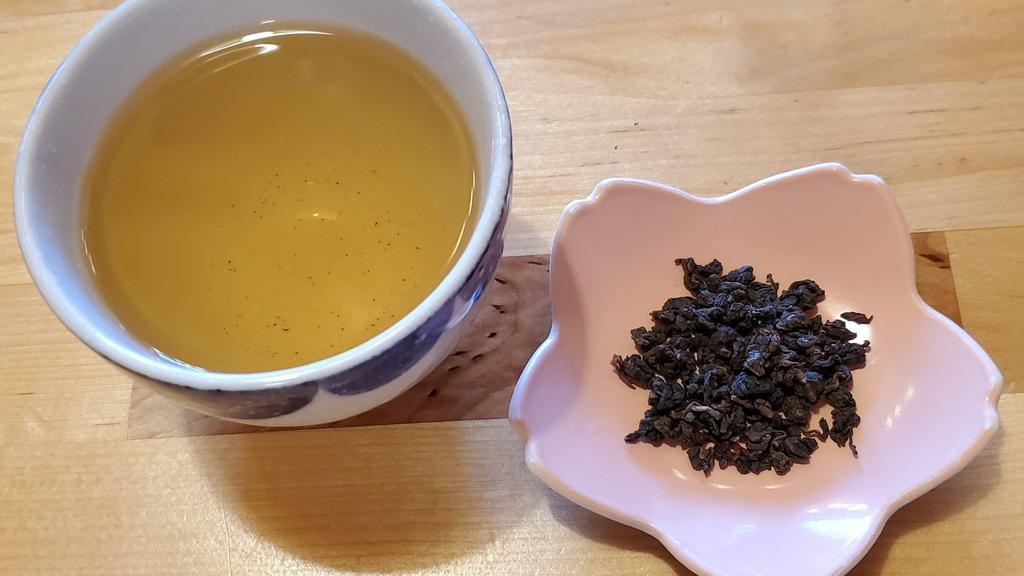 Iron Goddess Of Mercy - Oolong Tea · 16 oz. Our iron goddess of mercy is hand-crafted twice each year, in spring and winter, by a fourth-generation artisan oolong teamaker in Mingjian village in Taiwan's Central Nantou County. Our iron goddess of mercy is made from Wuyi and Qingxin oolong tea cultivars and is crafted in the traditional style, with medium oxidation and moderate roasting through a controlled baking by electric brazier. This carefully managed process creates a smooth palate that exudes aromas of roasted buckwheat w...
