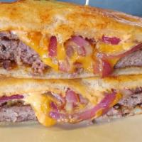 Parmesan Patty Melt · Topped with cheddar, sautéed red onions, and thousand island dressing. Served on sourdough P...