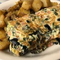 Greek Omelette Platter · Mushrooms, feta cheese, olives, home fries and toast.