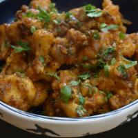 Cauliflower Manchuria · Cauliflower fritters tossed in Indian spiced garlic, ginger, green chillies & onions