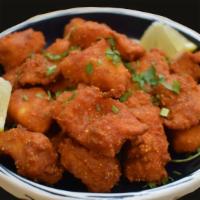 Fish Koliwada · Basa/Tilapia marinated in Indian spiced ginger, garlic, and fried with chickpea flour.