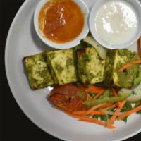Cilantro Paneer · Indian cottage cheese marinated in Indian green herbs w/ green, red bell peppers & onions