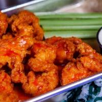 Boneless Wings · Coated in our favorite sauce served with celery & ranch