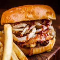 Smokehouse Burger · Smoked gouda cheese, bacon, onion straws & honey BBQ served with lettuce, tomato, onion, pic...