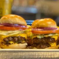 Double Dribble Sliders · Double cheeseburger sliders served with American cheese, lettuce, tomato, pickle, parmesan m...