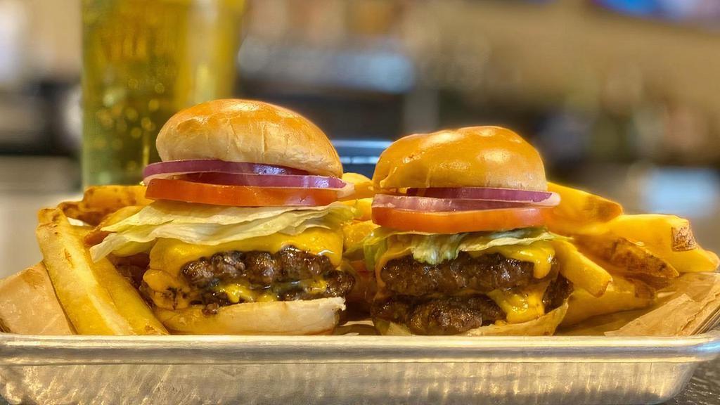 Double Dribble Sliders · Double cheeseburger sliders served with American cheese, lettuce, tomato, pickle, parmesan mayo & fries.