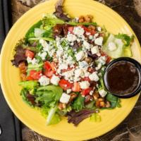 Aegean Salad · Romaine lettuce, mixed greens, tomatoes, dates, candied walnuts, and gorgonzola cheese serve...