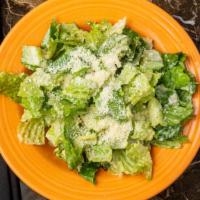 Side Caesar Salad · Romaine lettuce tossed with parmigiano-reggiano cheese and our house-made Caesar dressing.