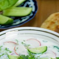 Okroshka Soup · Cold soup with sour yogurt broth, corned beef, daikon radish, green onion, cilantro and cucu...