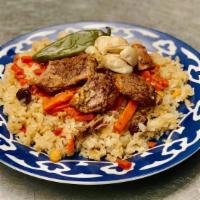 Plov · Traditional uzbek dish. Braised lamb, rice, roasted garlic, chili pepper, chick peas, carrot...