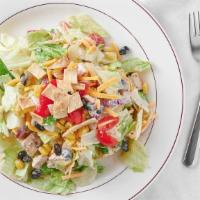 Santa Fe Chicken Salad · Mixed greens, corn and black bean salsa, Cheddar cheese, crisp tortilla strips, chopped toma...