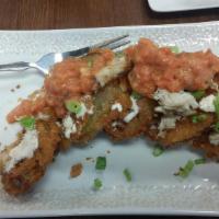 Fried Green Tomatoes · Topped withBoursin cheese, tomato basil cream sauce and lump crab meat.