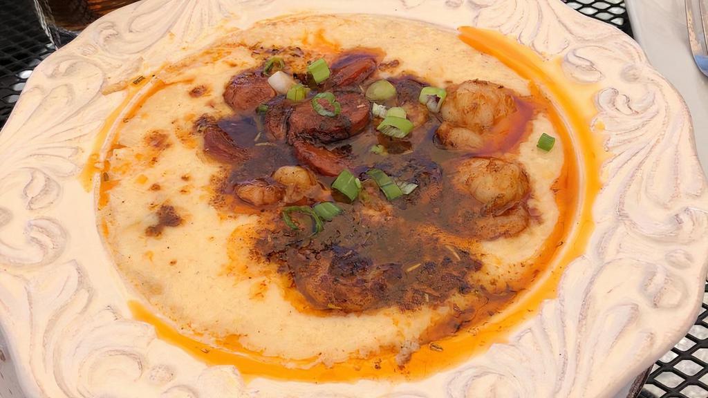 Shrimp And Grits · Cheesy corn grits topped with shrimp and andouille sausage and New Orleans buttery BBQ sauce.