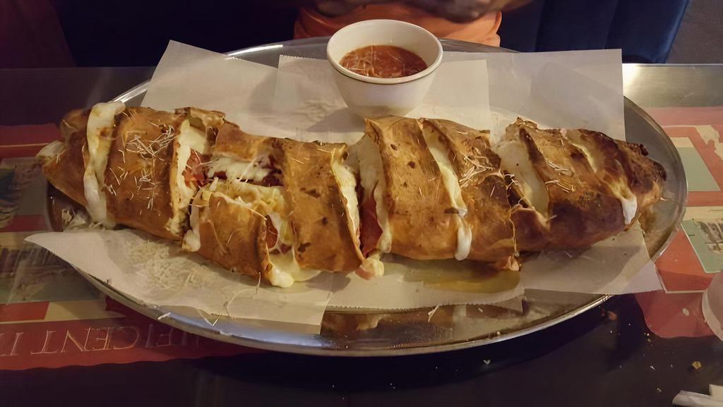 Pepperoni Pizza Rolls · Pizza dough rolled & stuffed with mozzarella cheese, pepperoni and Buscemi’s famous pizza sauce, topped with parmesan & butter.