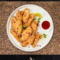 Sweet Chili Thrill Wings · Fresh chicken wings breaded, fried until golden brown, and tossed in sweet chili sauce. Serv...