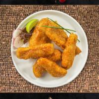 Before The Buffalo Tenders · Chicken tenders breaded and fried until golden brown before being tossed in buffalo sauce.