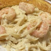 Shrimp Fettuccine Alfredo · Creamy alfredo sauce tossed with fettuccine, sprinkled with parmesan. Topped with grilled sh...