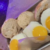 Mashugawich Sliders · Brisket sliders topped with sunny side up eggs.
