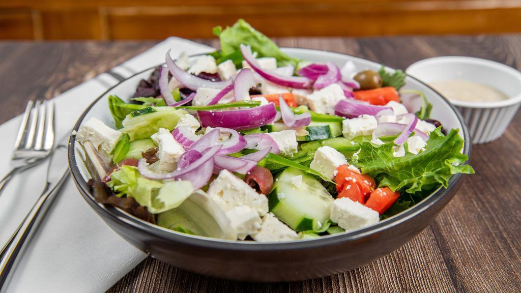 Greek Salad · Fresh mixed greens, red onion, feta cheese, black & green olive mix, cucumber and balsamic-olive oil dressing.