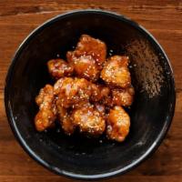 Chicken Bites · Korean Fried Chicken Bites (Gangjeong) tossed in our Sweet Glaze or Burnin' Sauce.