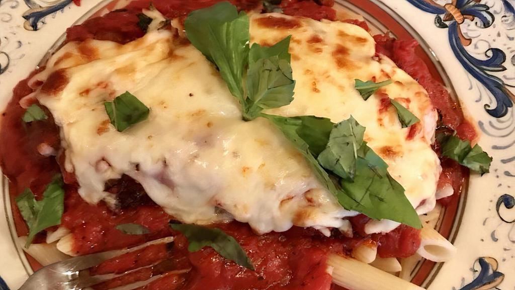 Chicken Parmesan Pasta · Lightly breaded and fried to a golden brown topped with our homemade marinara sauce and melted mozzarella and Parmesan cheese served over your choice of pasta.