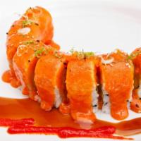 Nemo Roll · In: California roll. Out: baked salmon with special sauce, tobiko and green onion.