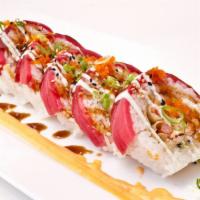 Fresno Roll · In: salmon, yellowtail and shrimp tempura soy wrapped and deep-fried. Out: rice wrapped with...