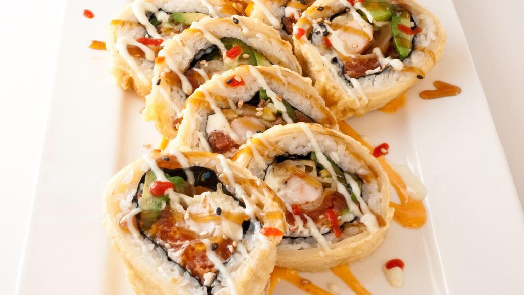 Snake Roll · In: spicy tuna, crab meat shrimp tempura, cream cheese avocado, and jalapeño. Out: tortilla deep dried.
