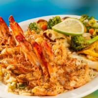 Butterfly Shrimp (8) · Cooked on the grill with style shrimp Mariposa (Butterfly) seasoning. Served with fried rice...