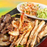 #50 Parri Mix Con Camaron Para 2 · Mix Fajitas (Beef Fajita & Chicken Fajita) with Shrimp for 2 people. Served with Mexican ric...