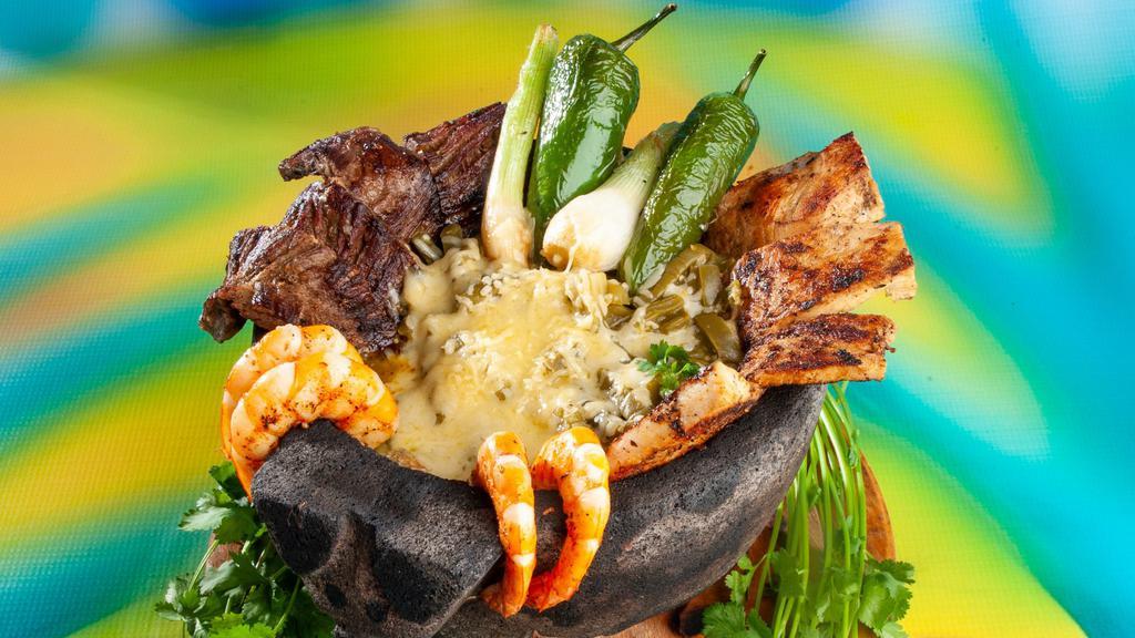Molcajete Para 1 · Beef Fajita, Chicken Fajita, Shrimp topped with Green Sauce, Cactus and White Melted Cheese for 1 Person. Served with Mexican rice, refried beans or Charro beans, pico de Gallo, guacamole, and tortillas.