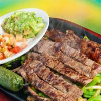 #15 Fajitas Asadas · Beef strips with grill onions and bell pepper. Served with rice, charro beans, pico de Gallo...