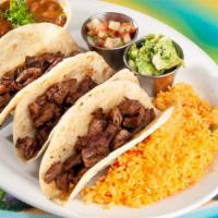 #11 Tacos Al Carbon Beef Fajita (3) · Served with rice, charro beans, pico de gallo & guacamole.