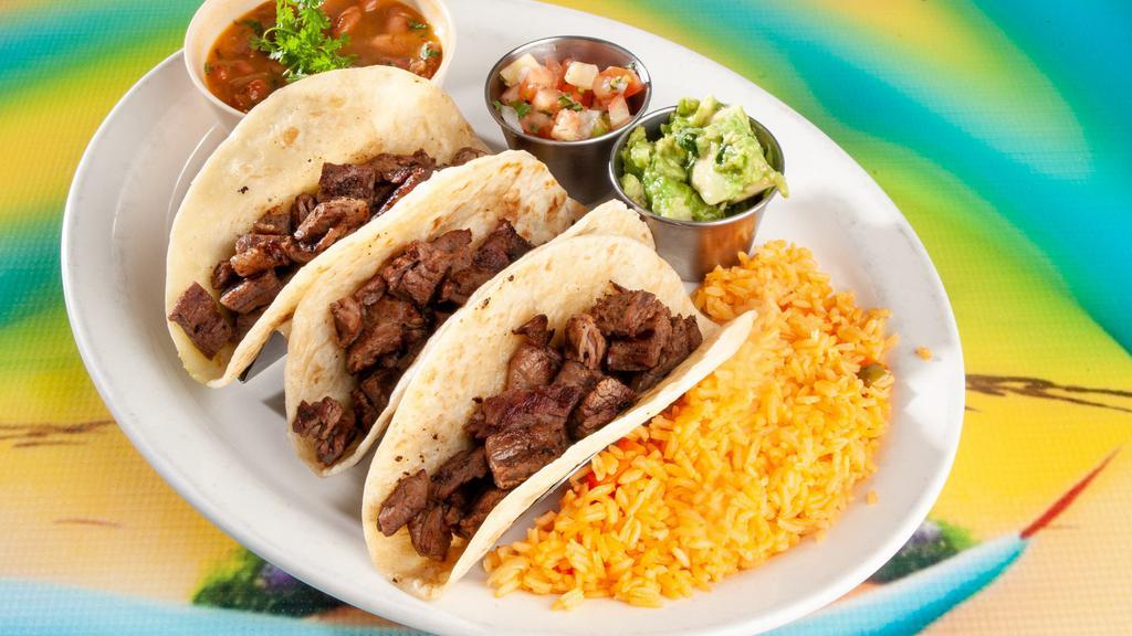 #11 Tacos Al Carbon Beef Fajita (3) · Served with rice, charro beans, pico de gallo & guacamole.