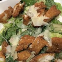 Caesar Salad · Romaine Hearts tossed with Caesar Dressing and grated Parmesan.