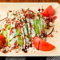 Wedge Salad · Iceberg, Bacon, Tomato, Red Onion, Ranch Dressing Topped with B/C Crumbles & Balsamic.