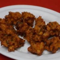 Chicken Pakora(G) · Chicken breast pieces battered in gram flour with spices & deeply fried.