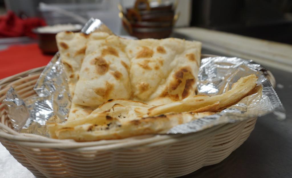 Garlic Cheese Naan · Naan stuffed with cheese & tossed with garlic