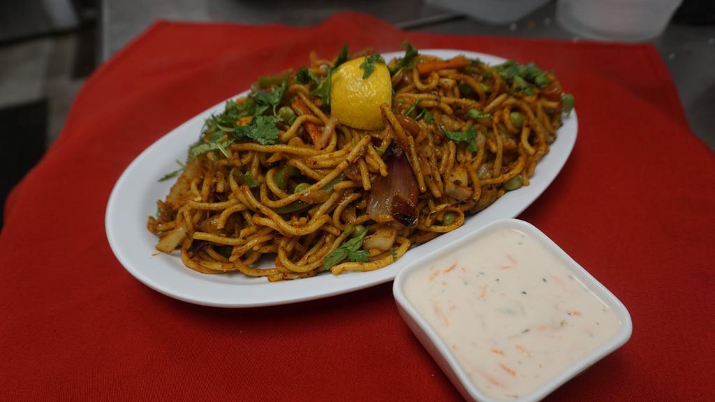 Chicken Chow-Min · Noodled, fresh vegetables and chicken cooked with our mild spices