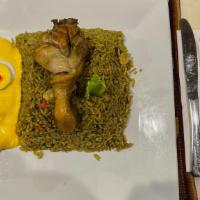 Arroz Con Pollo Y Huancaina · Green rice with chicken. Served with huancaina.