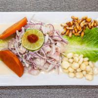 Ceviche De Pescado · Diced fresh fish seasoned with lemon and spices. Served with sweet potatoes & corn.